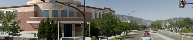 Chairs falling from the sky in a city street